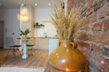 Widok z boku na Kuchnię mieszkania w stylu CountryHouse w Łodzi