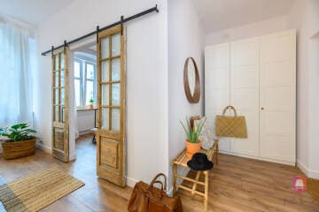 Otwarte wnętrze mieszkania w stylu CountryHouse w Łodzi - projekt Lilla Home